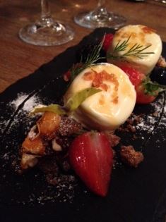 White chocolate mousse with milk chocolate crumble, fresh and frozen fruits and almond praline
