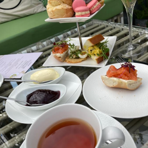 allbright afternoon tea with black tea, sandwiches, scones, jam and cream pictured