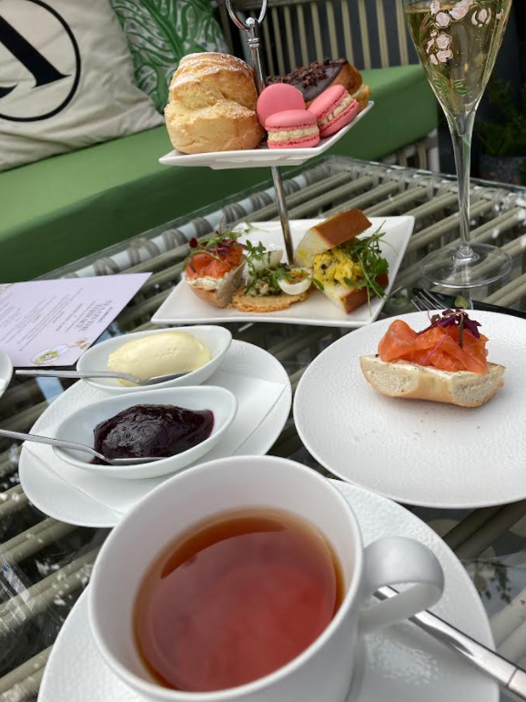 allbright afternoon tea with black tea, sandwiches, scones, jam and cream pictured