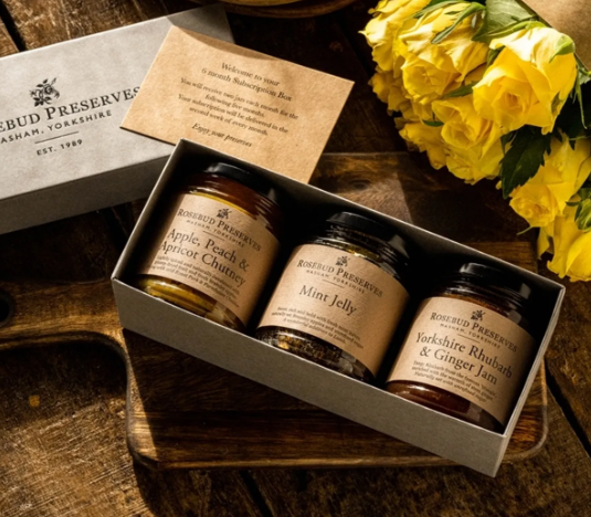 Image of three rosebd preserves in a box delivered as part of a subscription